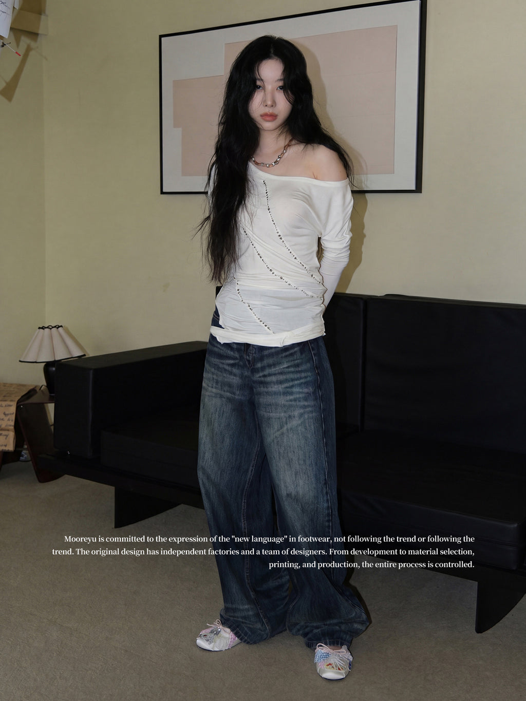 Full-body shot of female model wearing off-shoulder white top & blue wide jeans, styled with MOOREYU patchwork satin ballet flats